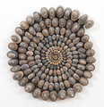 Mary Bauermeister, Kleine Steinspirale (Small stone spiral), 1962/2010, Stones on wood, Ø 40 cm, Photo: setform.de, 